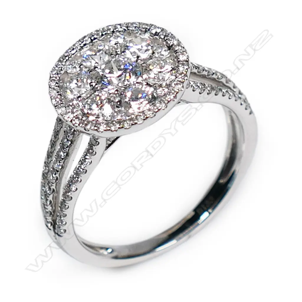 An 18ct white gold and diamond set cluster ring, Image 1++