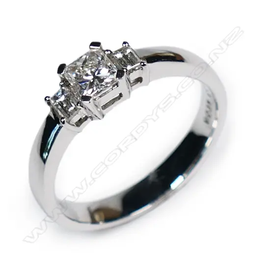 An 18ct white and three stone diamond ring,