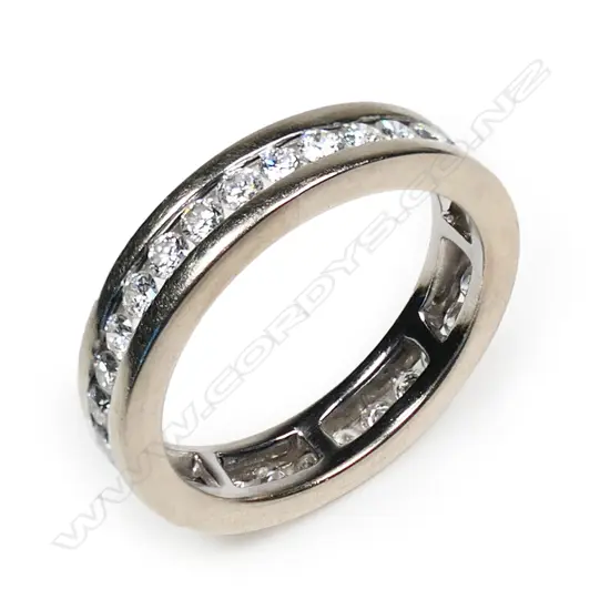 An 18ct white gold and diamond band,