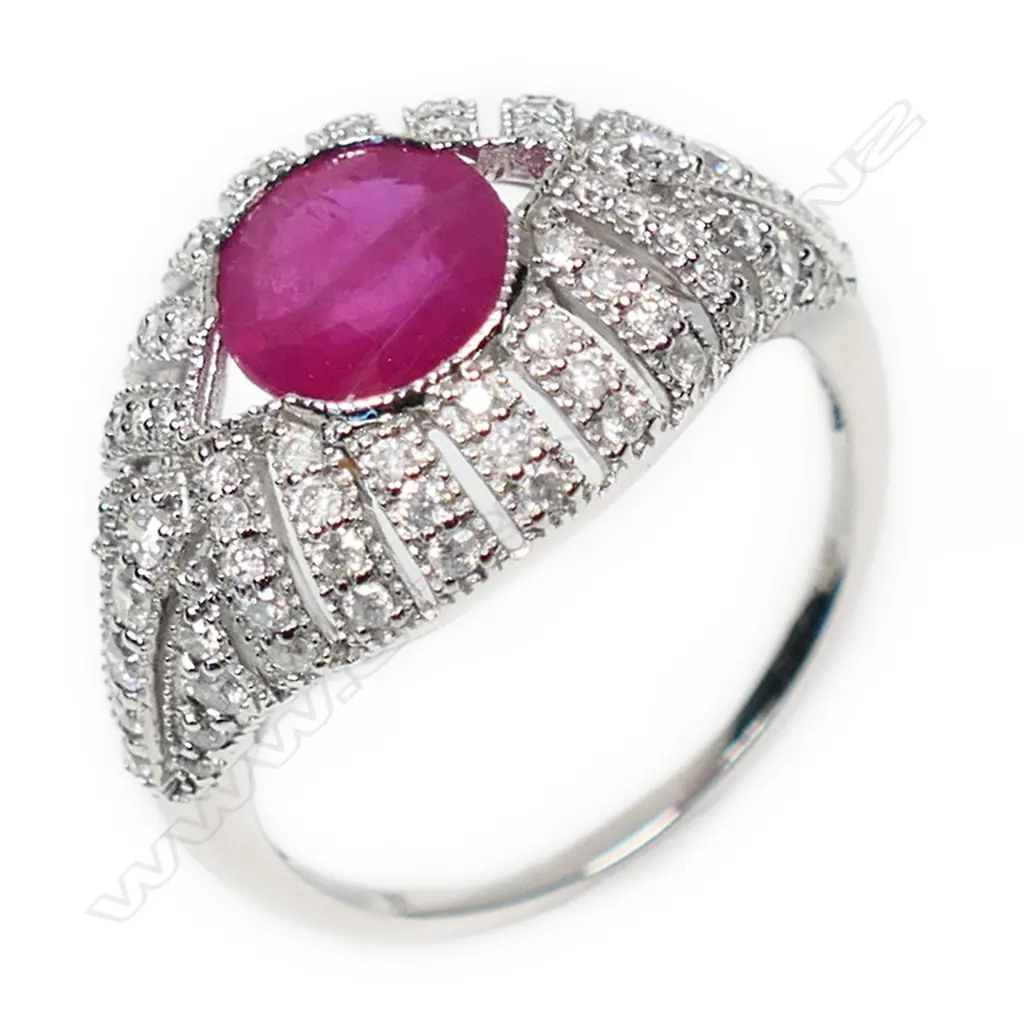 A 14ct white gold ruby and diamond cluster ring, Image 1++