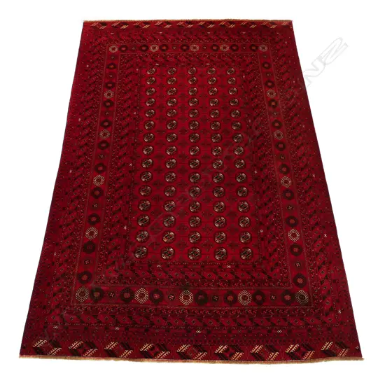 An old hand knotted Turkoman carpet.