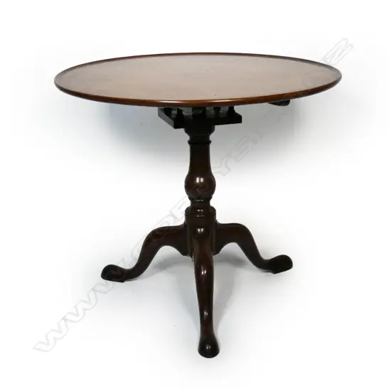 A George III mahogany circular tilt top wine table,