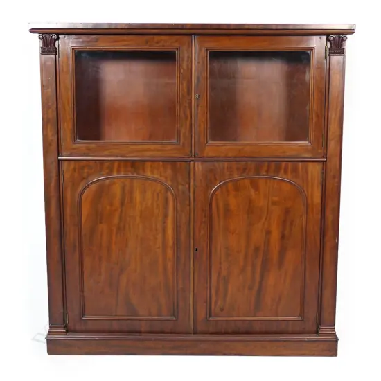 An early Victorian mahogany glazed bookcase cabinet,