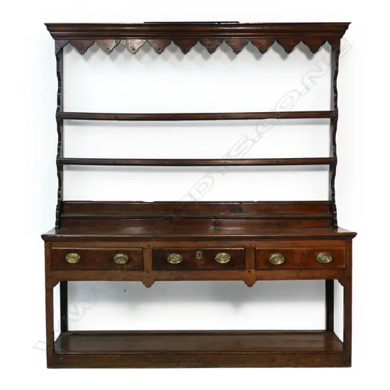 A Georgian oak Welsh dresser, with open plate rack back,
