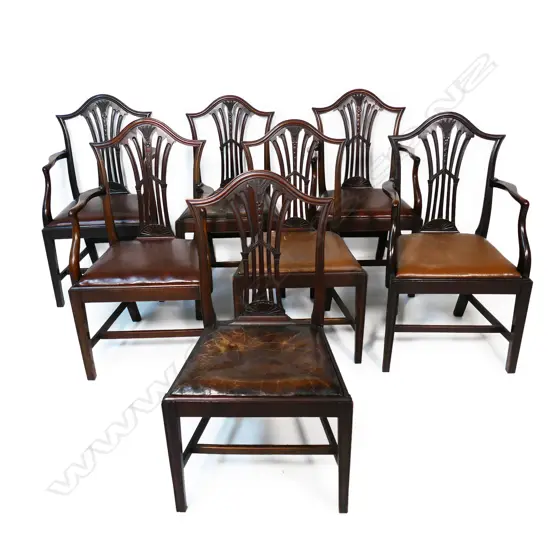 A set of seven rich dark mahogany Chippendale style dining chairs,