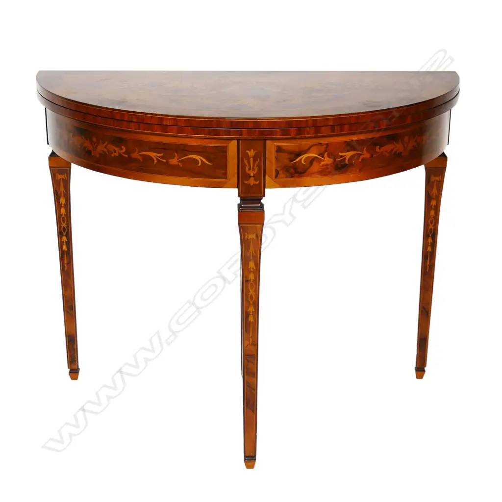 An Italian round marquetry fold over table, Image 1++