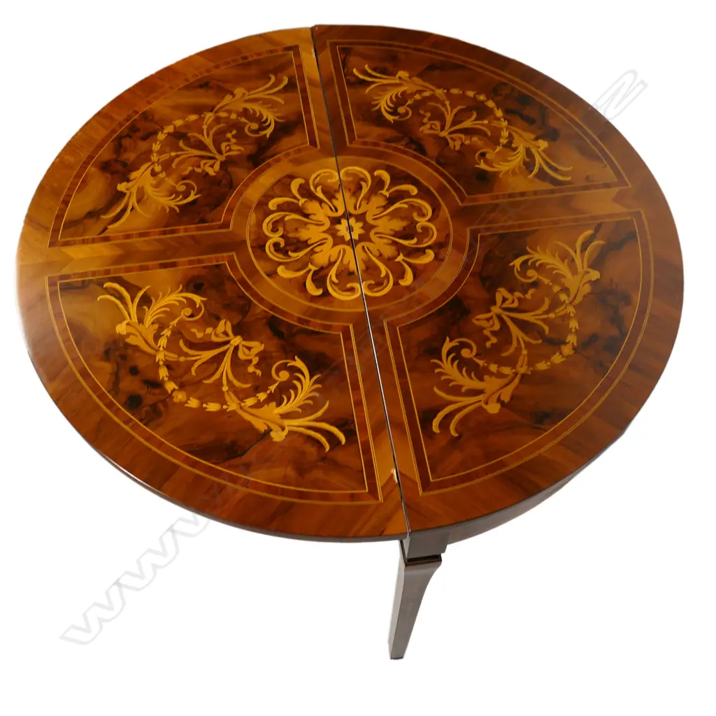 An Italian round marquetry fold over table, Image 1++
