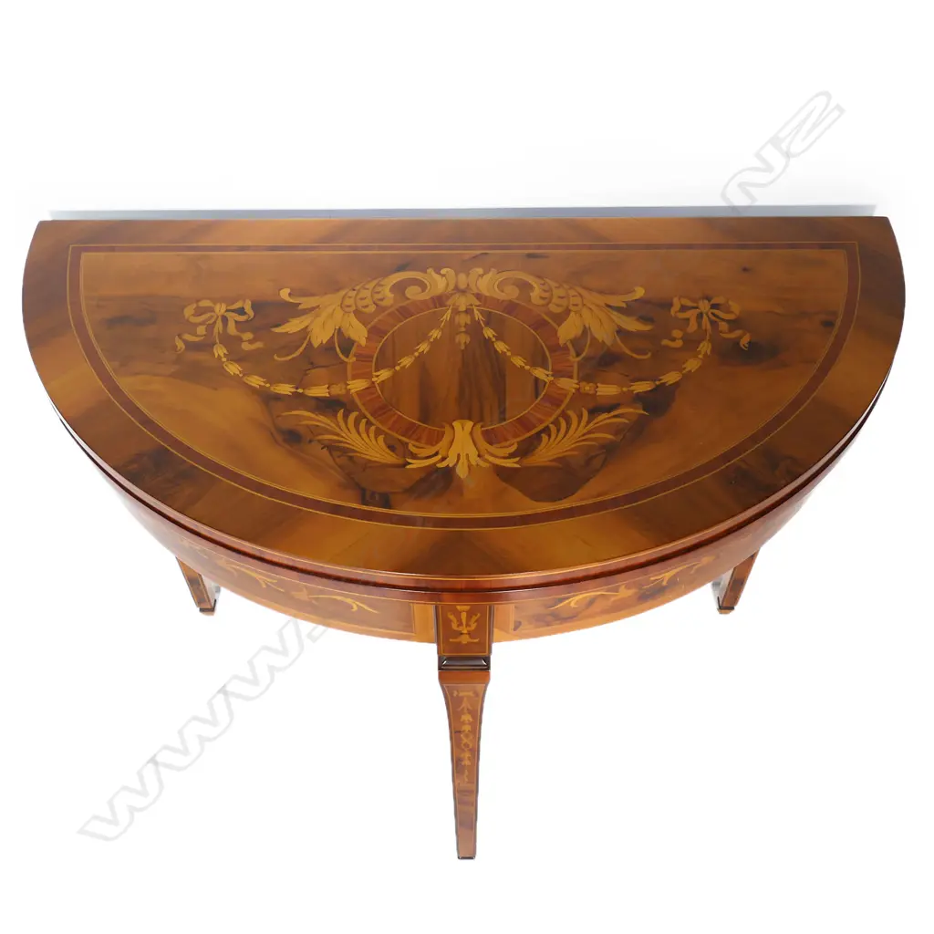 An Italian round marquetry fold over table, Image 1++