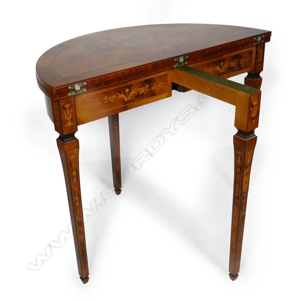 An Italian round marquetry fold over table, Image 1++