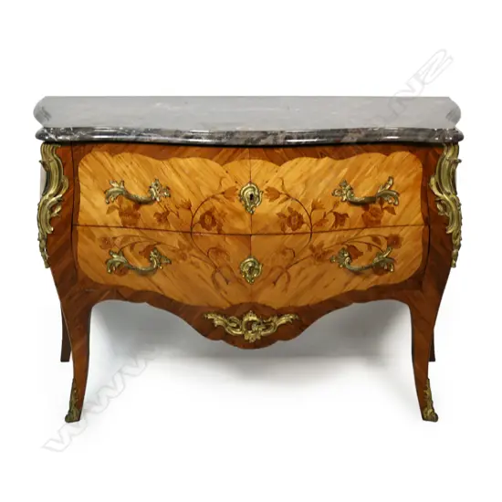 An early 20thC French bombé commode,
