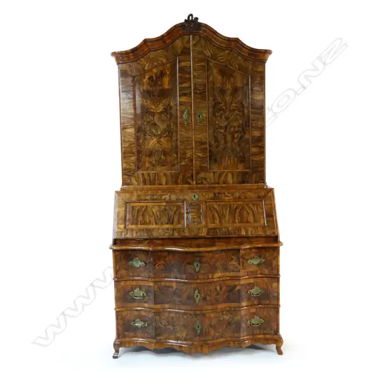 A 19thC German dark figured walnut bureau cabinet c.1750,