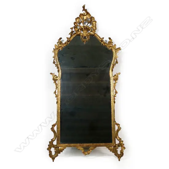 A French style carved giltwood framed elaborate wall mirror,
