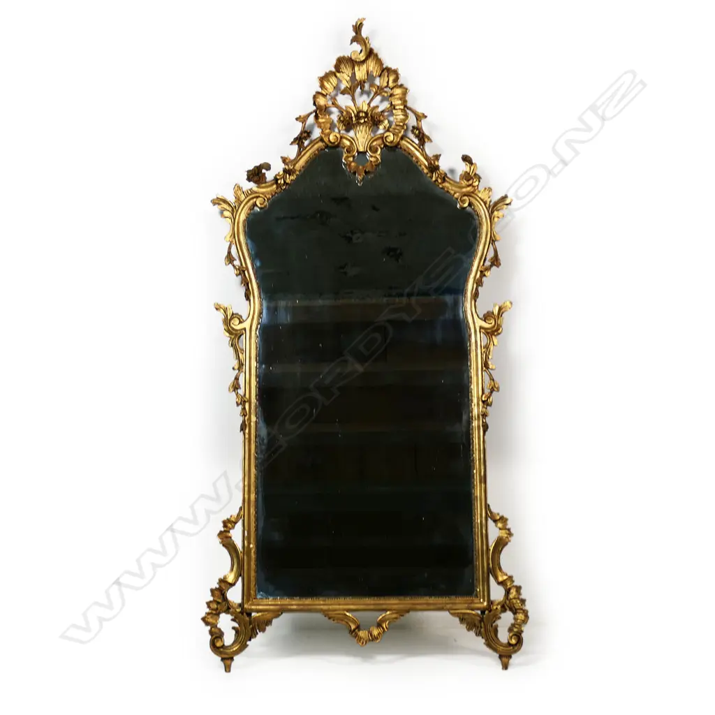 A French style carved giltwood framed elaborate wall mirror, Image 1++