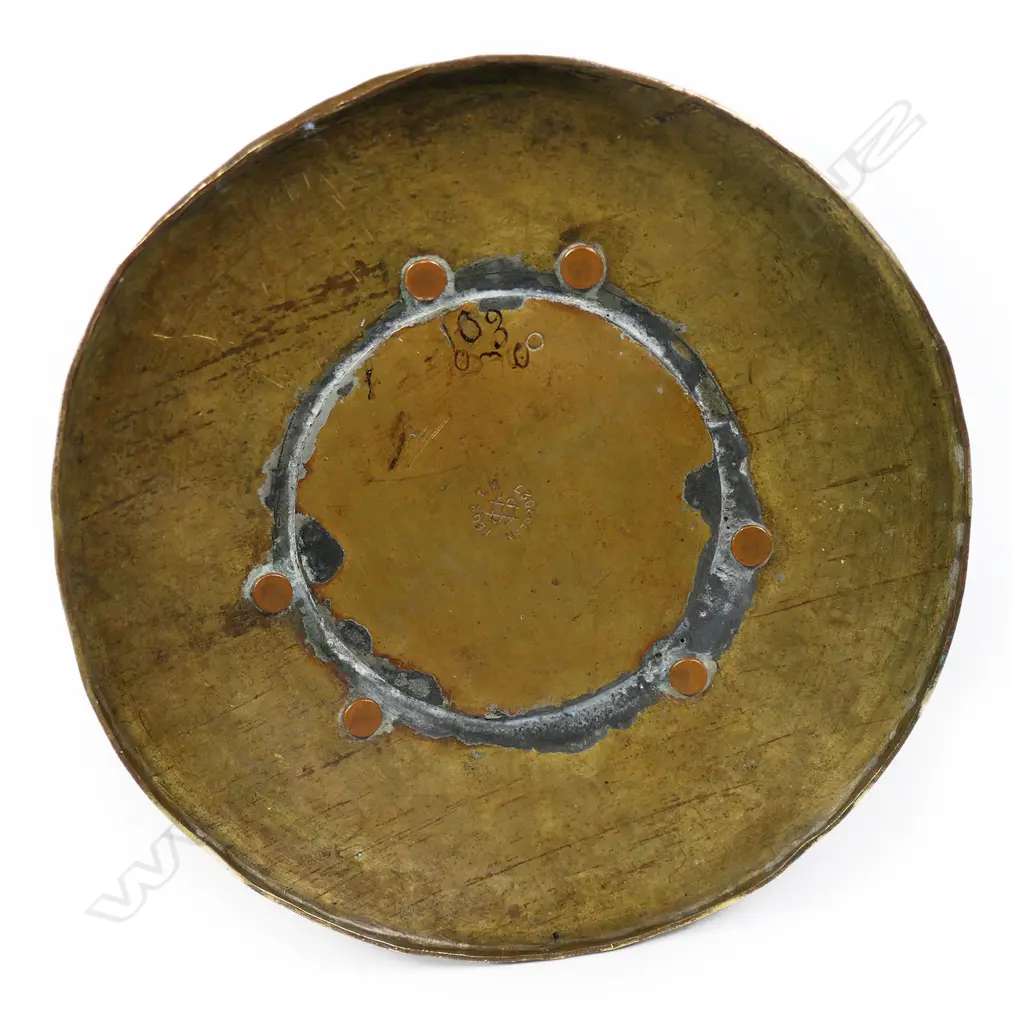 An Arts and Crafts hammered copper candlestick by Arthur John Seward, Image 1++