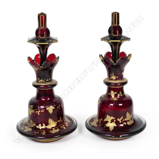 A pair of 19thC Bohemian red glass decanters,
