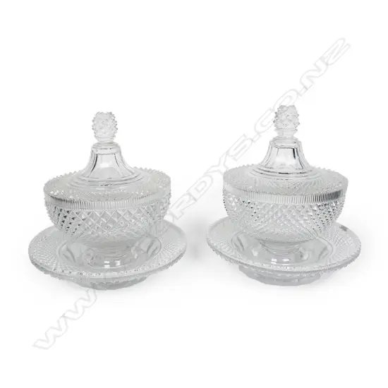 A quality pair of Victorian cut crystal lidded sweetmeat bowls on trays,