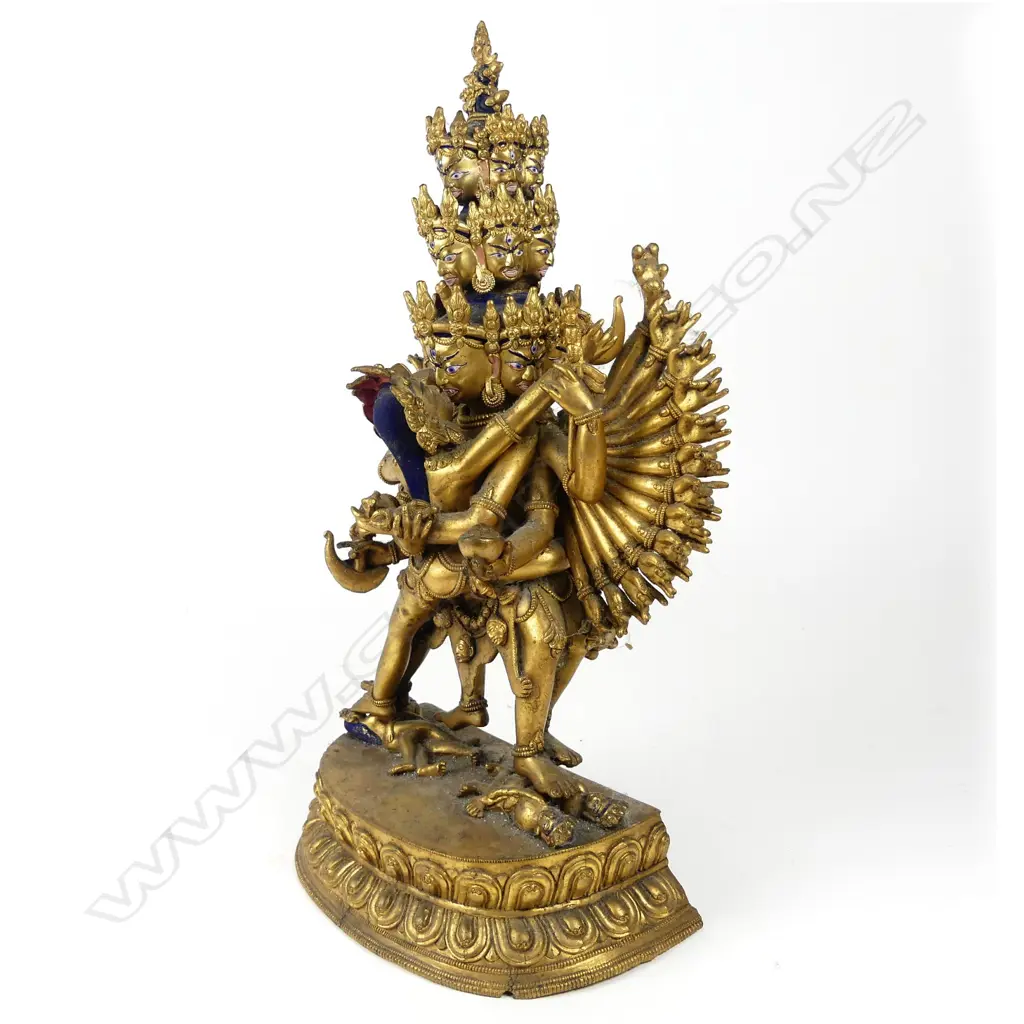 A Tibetan gilt bronze figure of a sixteen headed deity, Image 1++