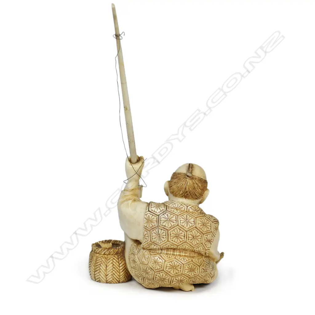 A Meiji Japanese carved ivory okimono of a fisherman, Image 1++