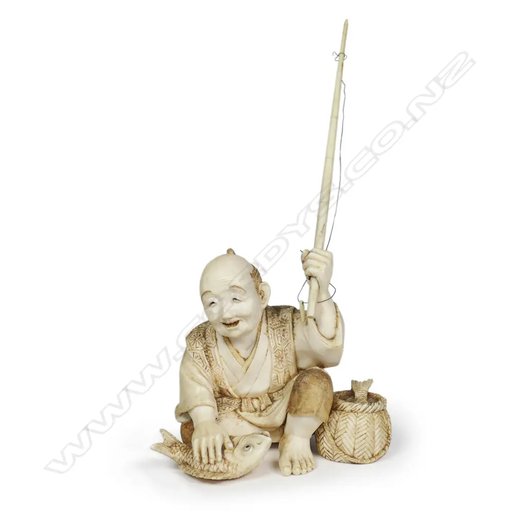 A Meiji Japanese carved ivory okimono of a fisherman, Image 1++