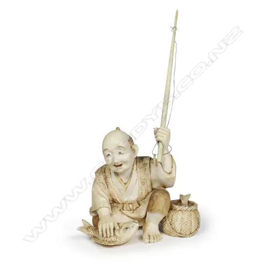 A Meiji Japanese carved ivory okimono of a fisherman,