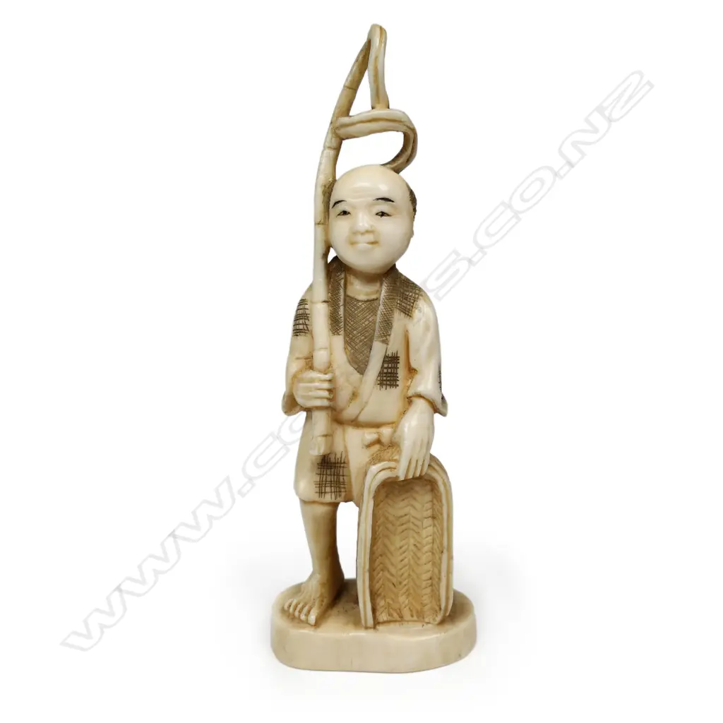 A Japanese Meiji carved marine ivory okimono of a farmer, Image 1++