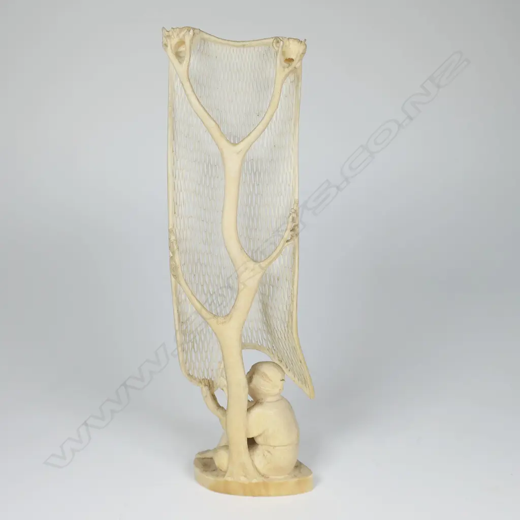 An old Japanese carved ivory okimono of a fisherman mending his large net, Image 1++