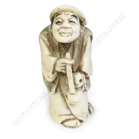 A Japanese carved ivory netsuke,