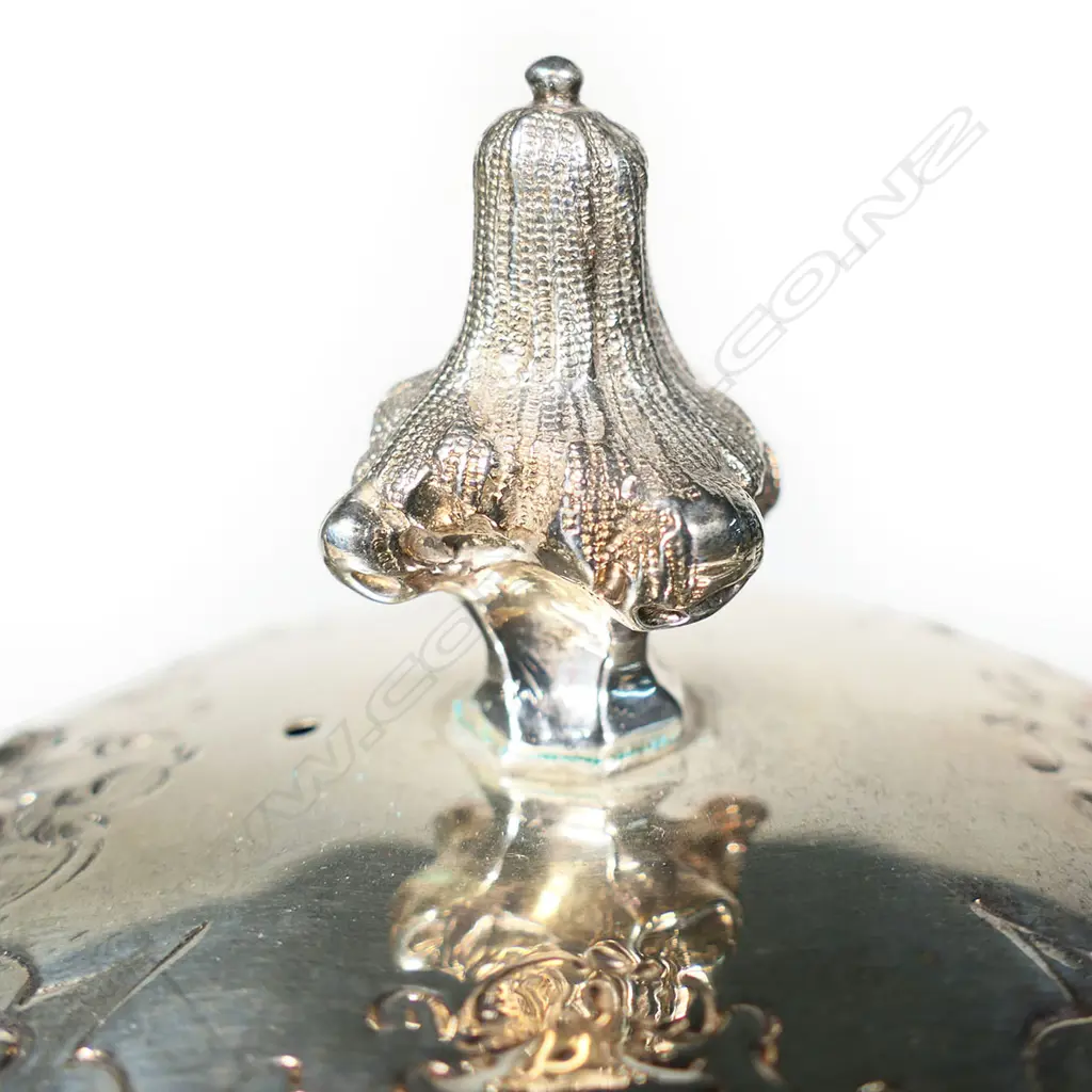 A decorative Victorian silver embossed teapot, Image 1++