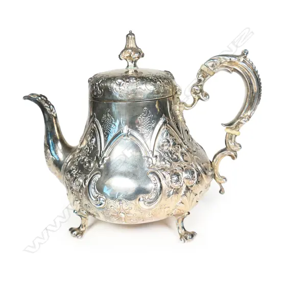 A decorative Victorian silver embossed teapot,