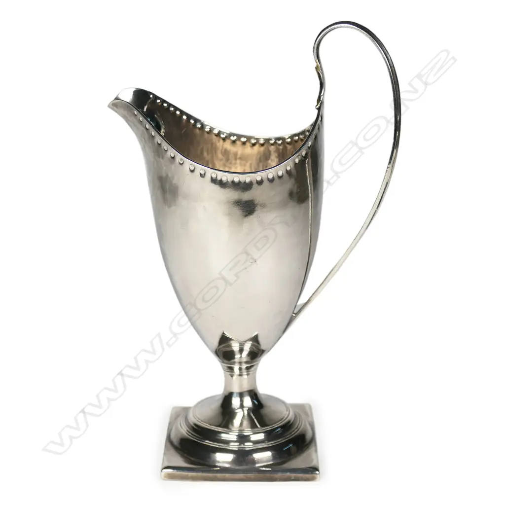 A George III silver helmet form cream jug, Image 1++