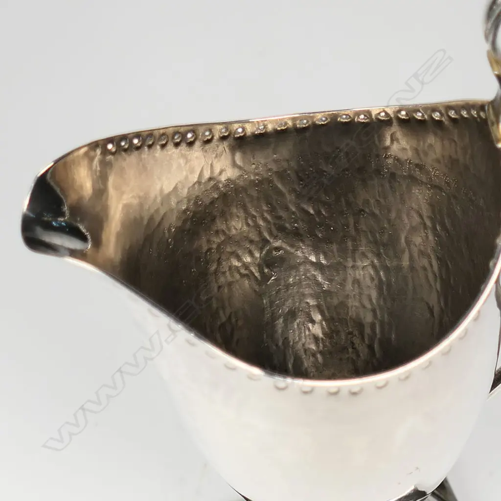 A George III silver helmet form cream jug, Image 1++