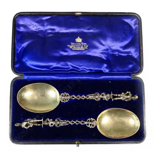 A pair of Victorian quality silver figured berry spoons,