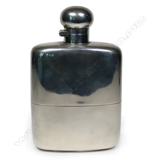 A large silver hip flask,