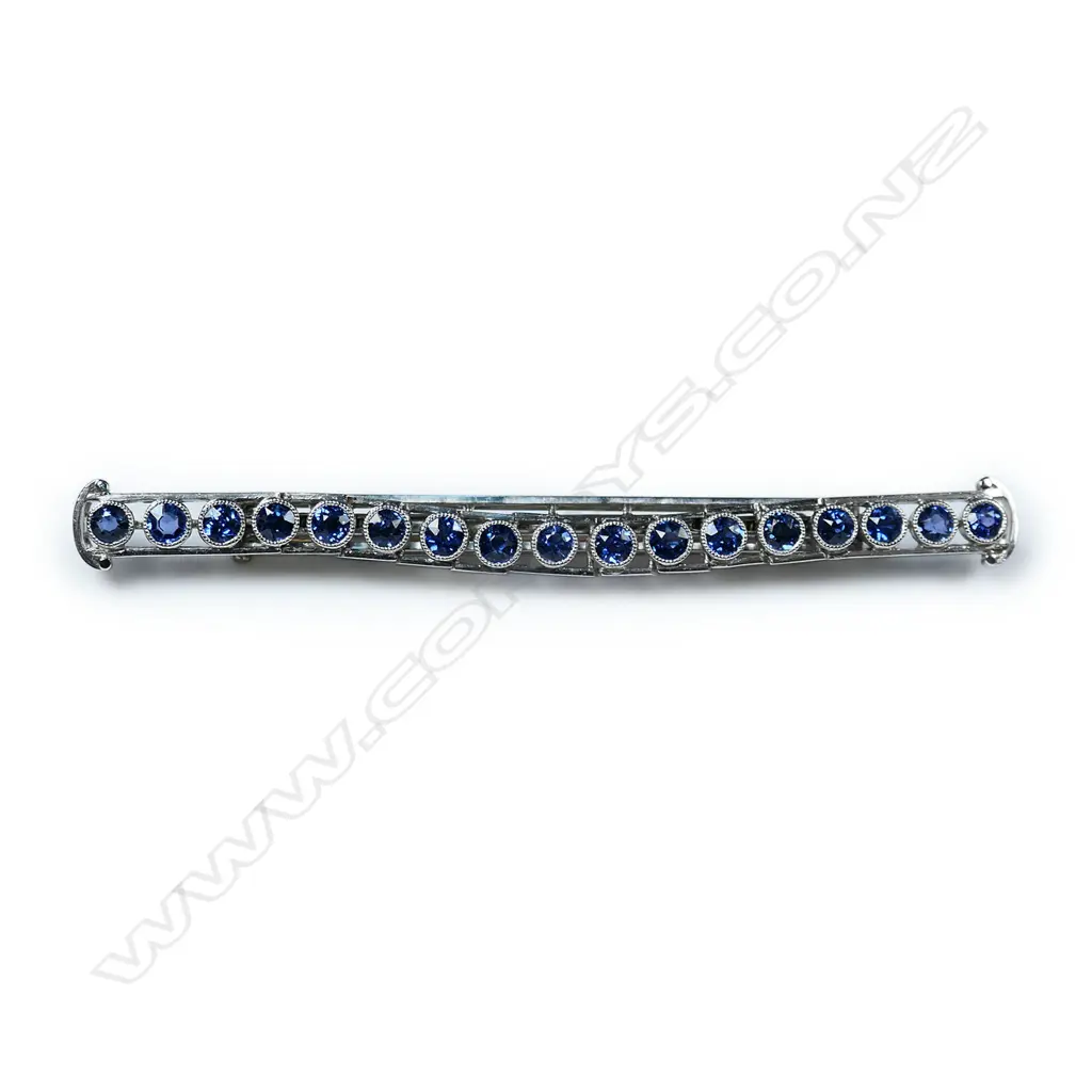 A platinum and sapphire bar brooch, Image 1++
