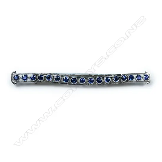 A platinum and sapphire bar brooch,