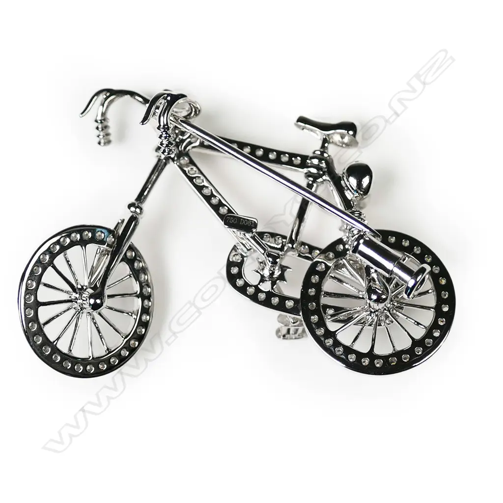 An 18ct white gold and diamond bicycle, brooch Image 1++
