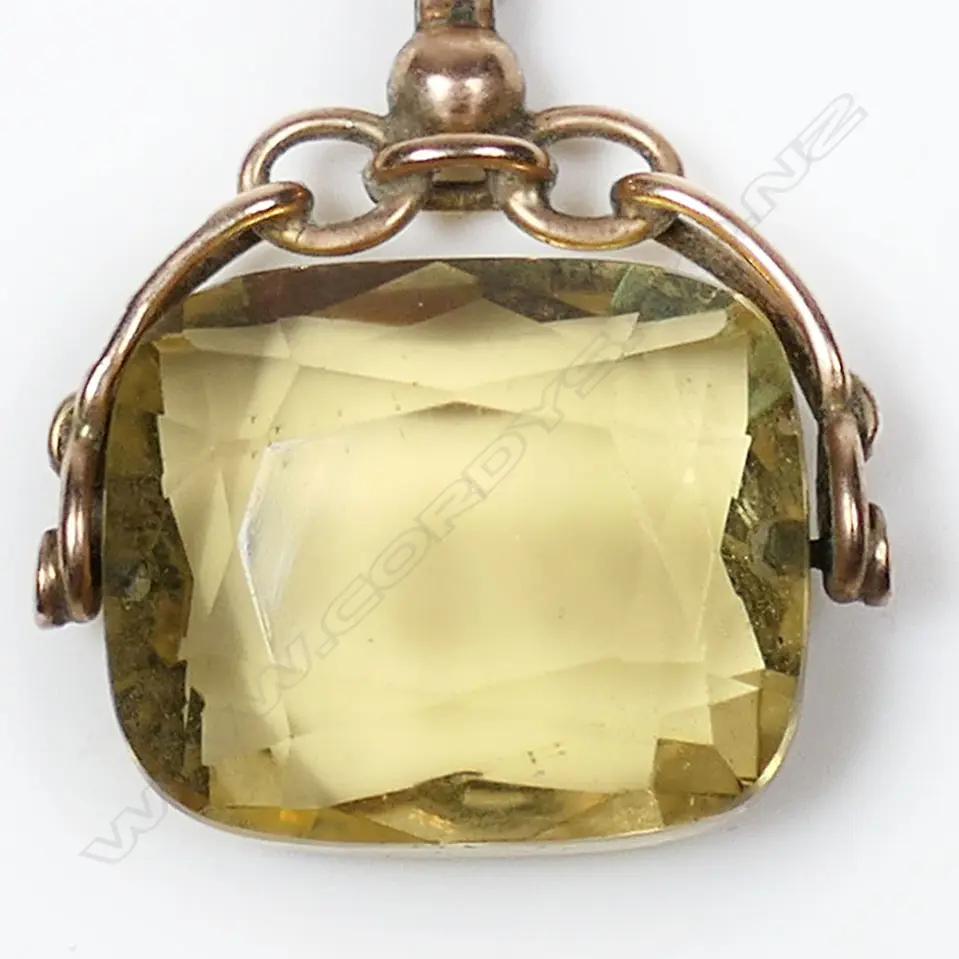 An Edwardian 9ct rose gold fob chain and citrine spinner, Image 1++