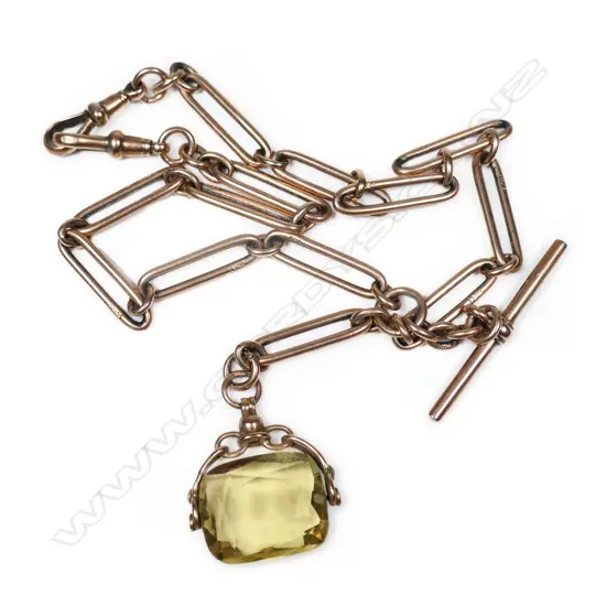 An Edwardian 9ct rose gold fob chain and citrine spinner,