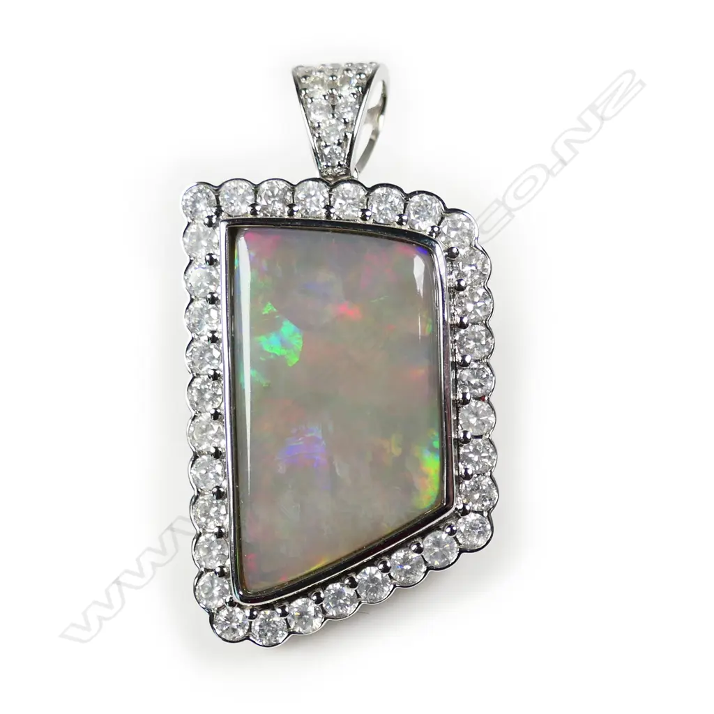 A 14ct white gold opal and diamond pendant, Image 1++
