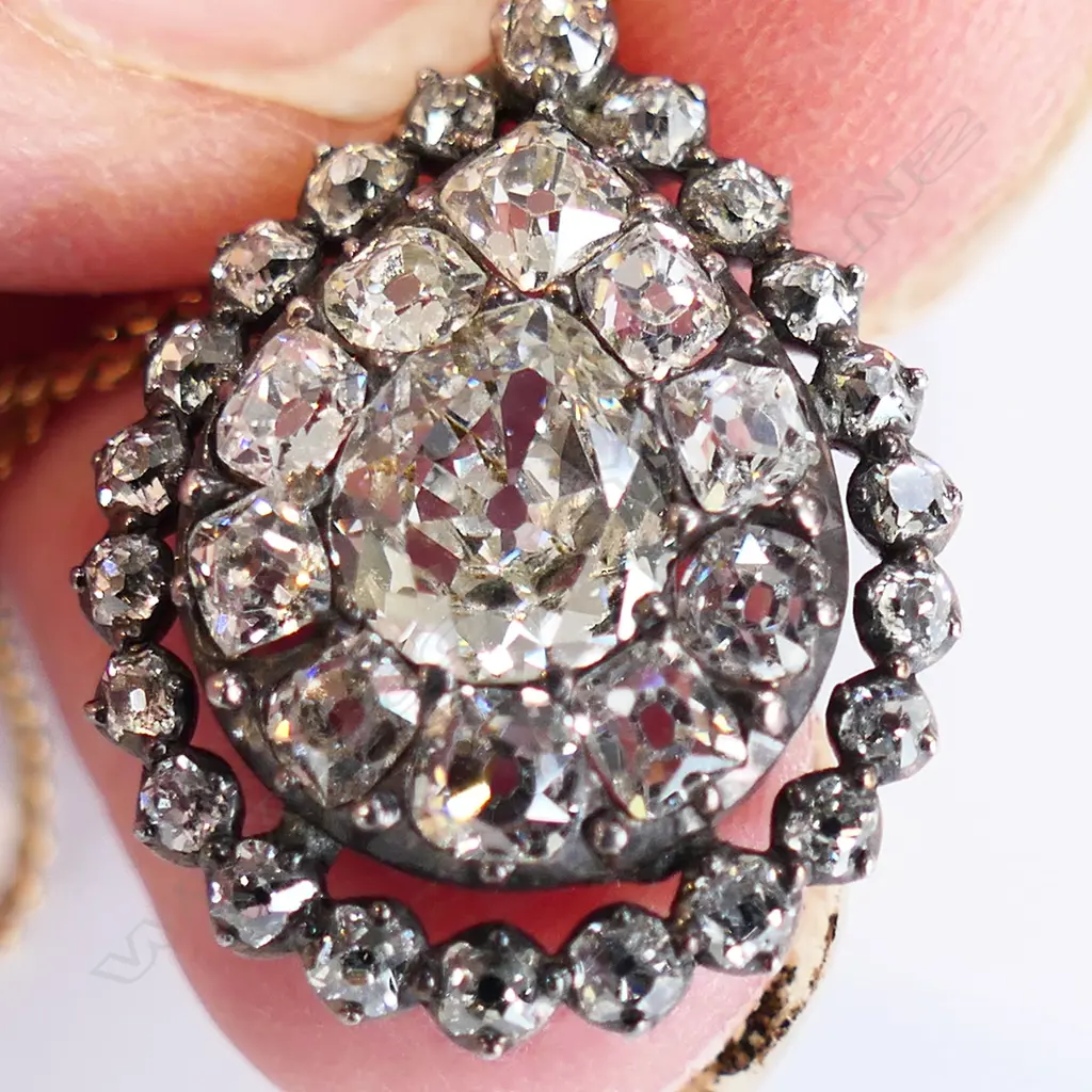 An antique 9ct gold and diamond pendant on 18ct gold chain, Image 1++