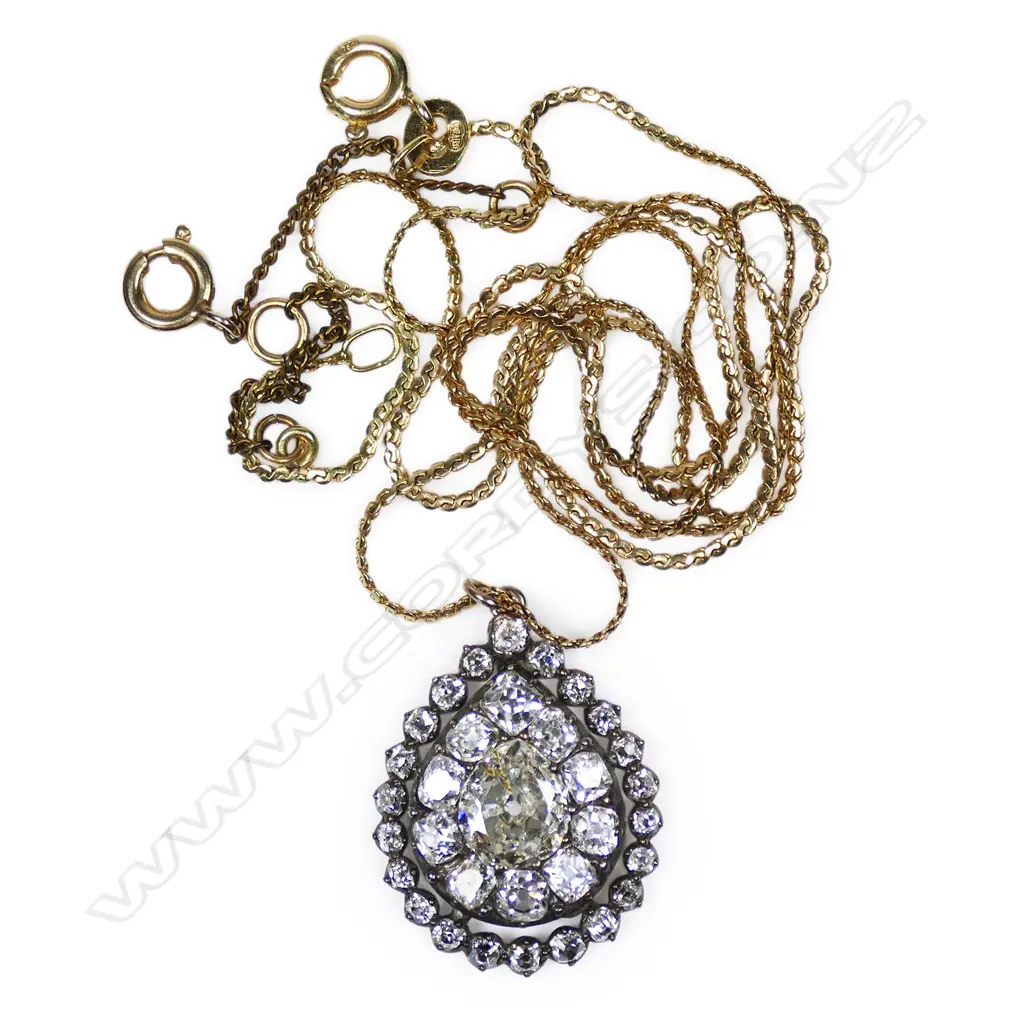 An antique 9ct gold and diamond pendant on 18ct gold chain, Image 1++