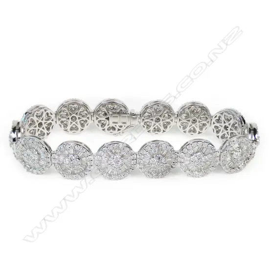 An impressive 18ct white gold and 14 diamond cluster bracelet,