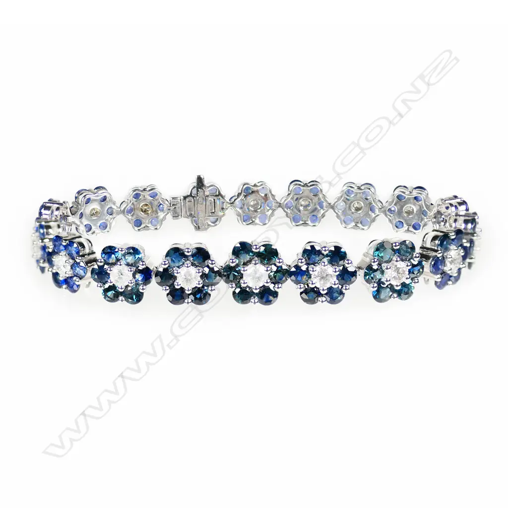 A 14ct white gold sapphire and diamond floral cluster bracelet, Image 1++