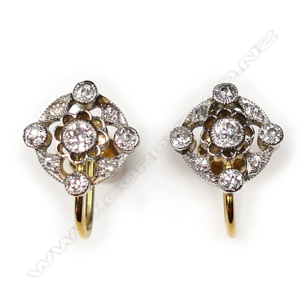 A pair of 18ct white fronted yellow gold and diamond cluster earrings, Image 1++