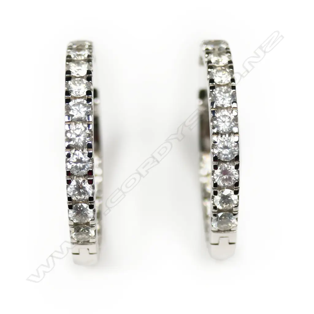 A pair of 14ct white gold and diamond hoop earrings, Image 1++