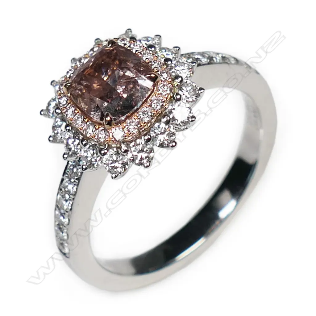 An 18ct white gold and diamond cluster ring, Image 1++