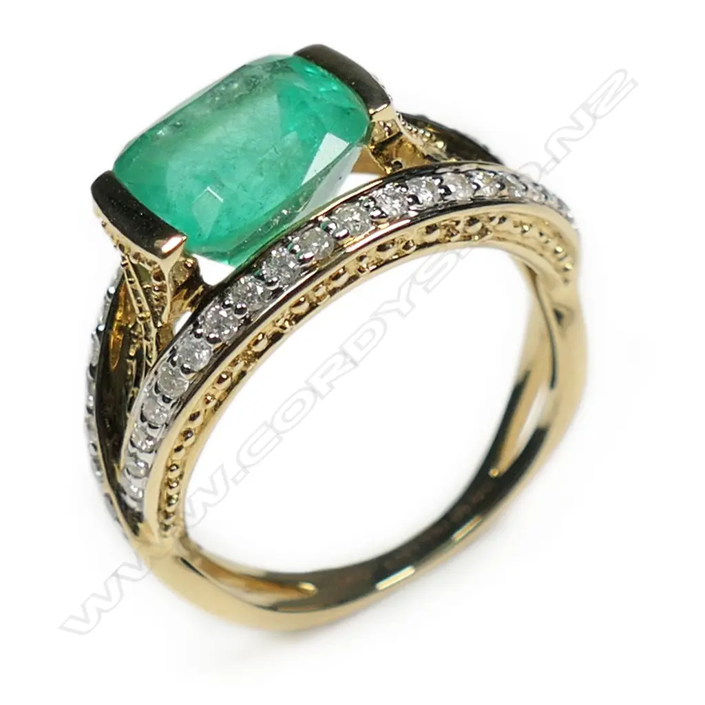 A 14ct gold Colombian emerald and diamond dress ring, Image 1++