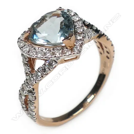 A 14ct rose gold, aquamarine and diamond heart shaped halo ring,