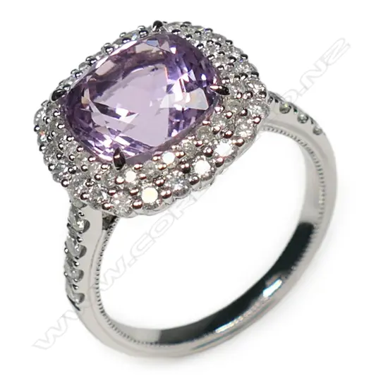A 14ct white gold kunzite and diamond double halo ring,