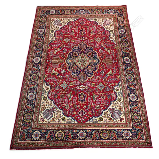 An Iranian hand-knotted Tabriz carpet,